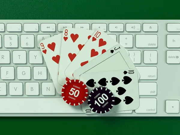 Cards and chips for poker on keyboard.
