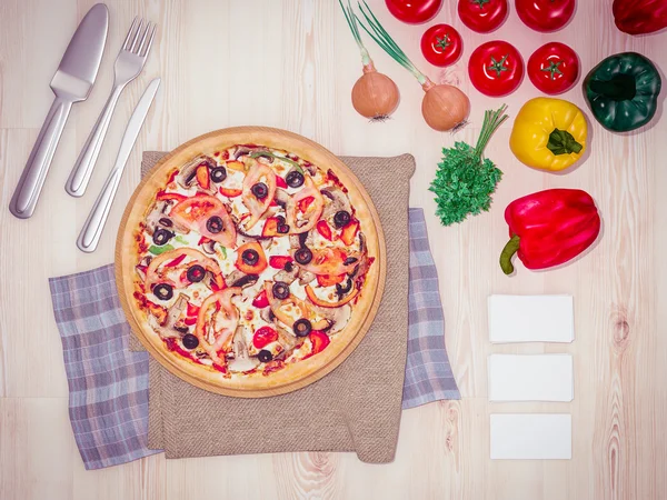 Mock up template pizza on a wooden table.