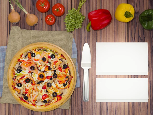 Mock up template pizza on a wooden table.