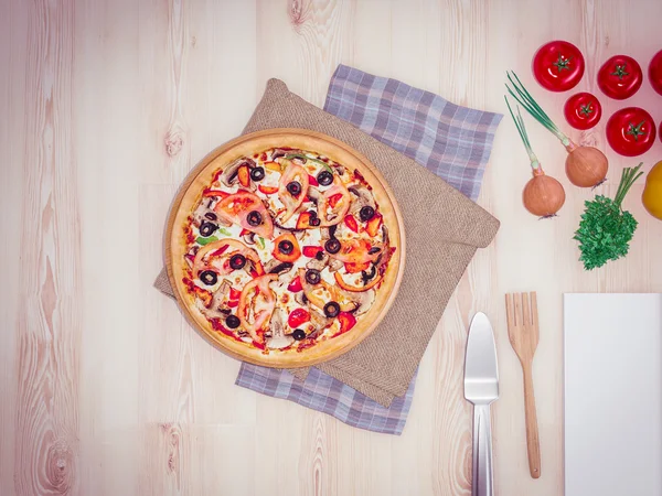 Mock up template pizza on a wooden table.