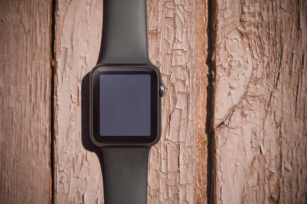 Smart watch on wood background. Mockup
