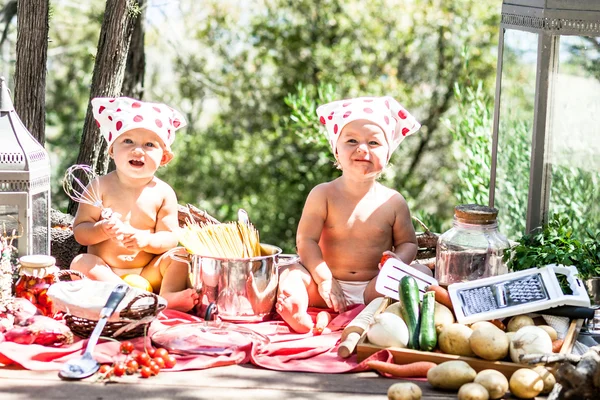 Happy children cook. Funny kids playing outdoors. Summer vacation concept