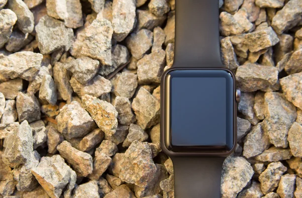 Smart watch on stone background. Mockup