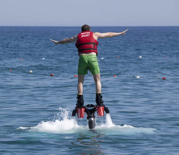 Unidentified Turkish man studying extreme flyboard