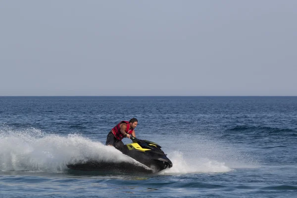 Unidentified Turkish man glides over the waves of the Mediterran