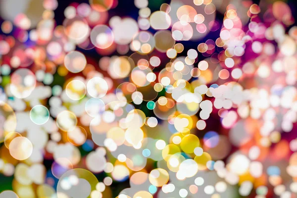 Abstract Festive background. Glitter vintage lights background with lights defocused. Christmas and New Year feast bokeh background with copyspace.