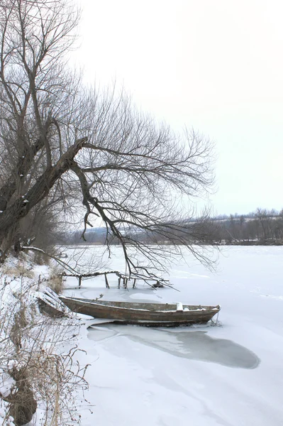 Winter landscape with a boat.