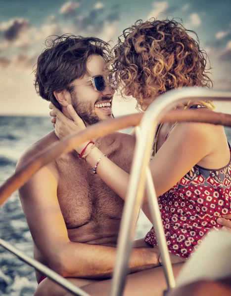 Loving couple on sailboat