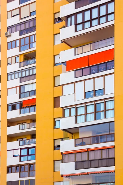 Modern buildings with balconies and terraces in yellow