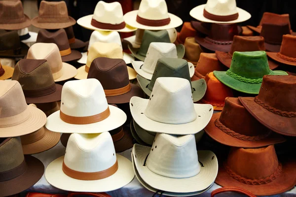 Hats in outdoor store stacked in rows