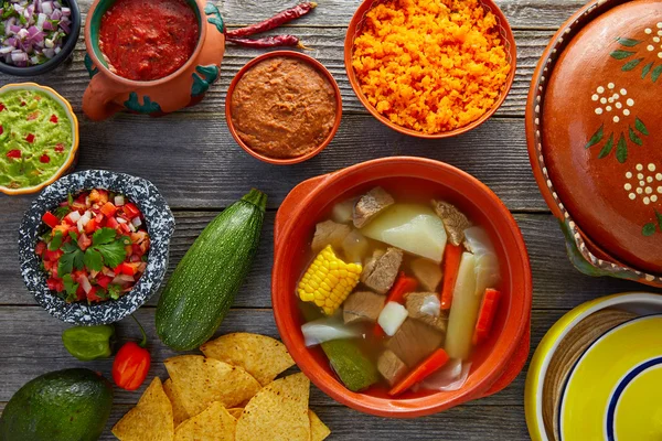 Caldo de res Mexican beef broth in table