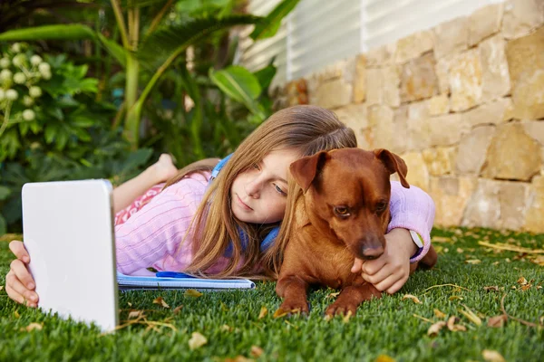 Blond kid girl selfie photo tablet pc and dog