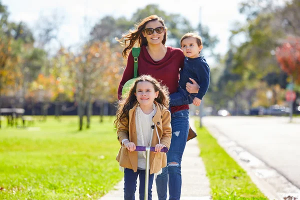 Mother daughter and son family in the park