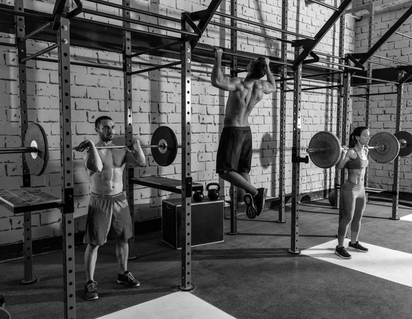 Barbell weight lifting group weightlifting at gym