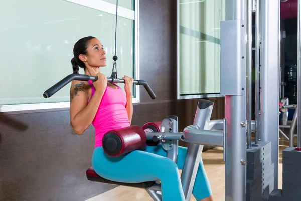 Lat pulldown machine woman workout at gym