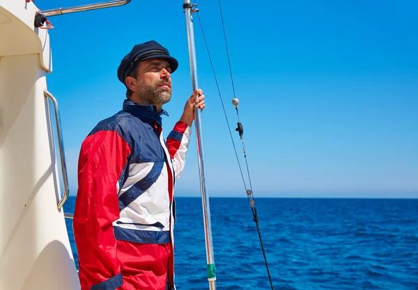 Beard sailor man sailing sea in a boat captain cap