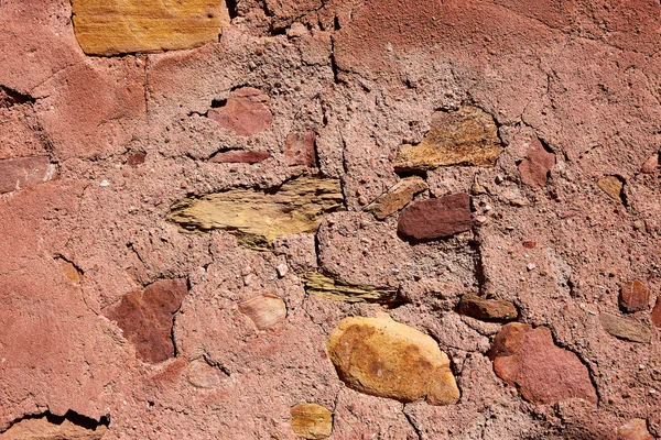 Red limestone masonry wall with rodeno mortar