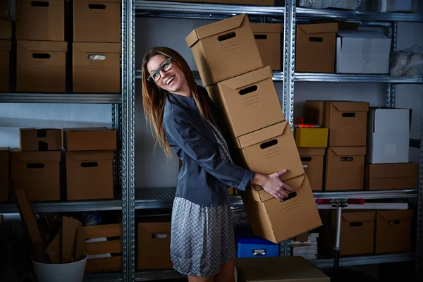 Funny businesswoman holding storage boxes