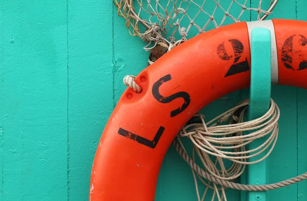 Orange life buoy on a boat