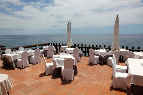 The open veranda restaurant overlooking the sea