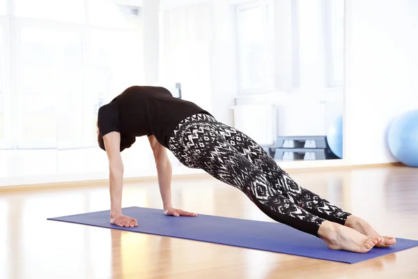 Female yoga instructor doing yoga