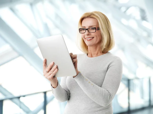 Active business woman with tablet