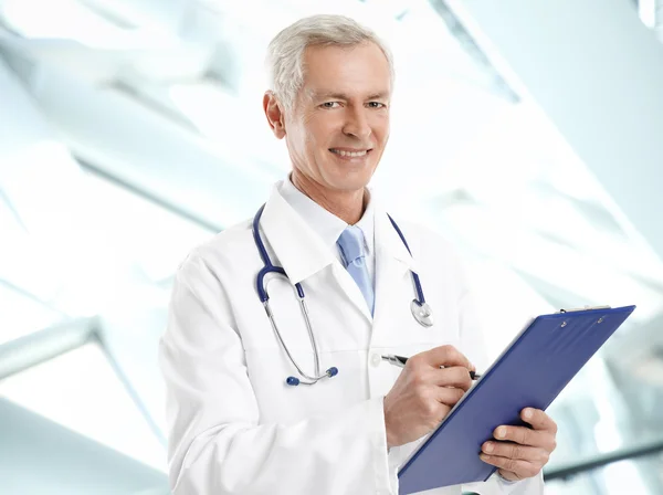 Male doctor with stethoscope and clipboard