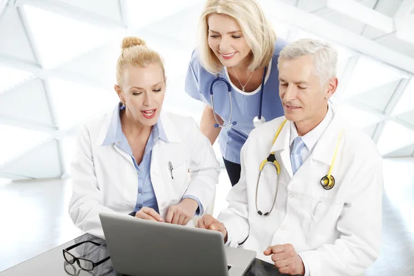 Doctors and nurses with laptop