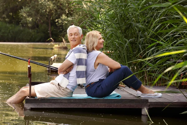 Happy old age couple fishing