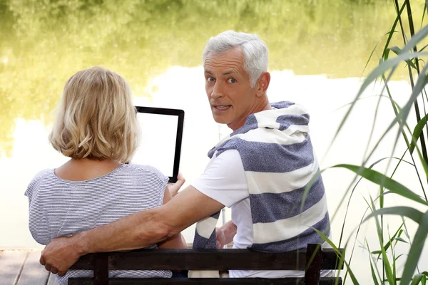 Senior couple with digital tablet