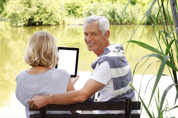 Senior couple with digital tablet