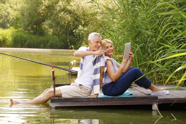 Elderly couple relax in nature