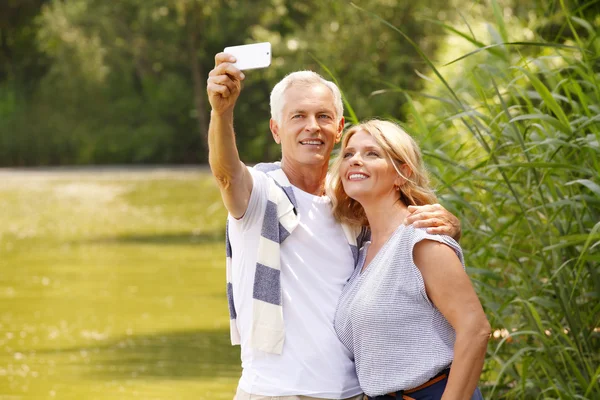 Senior couple taking selfie