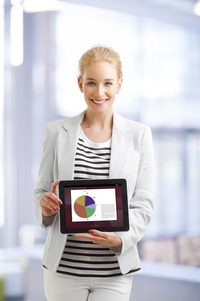 Financial businesswoman holding digital tablet