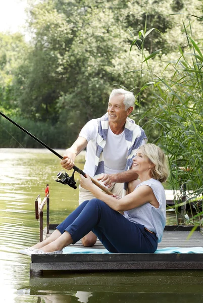 Senior couple fishing together