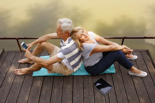 Senior couple relaxing on the pier