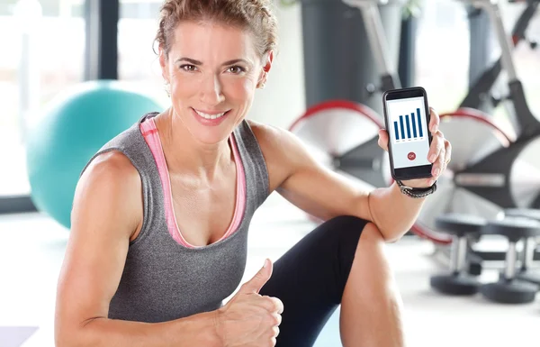 Woman checking the daily fitness app