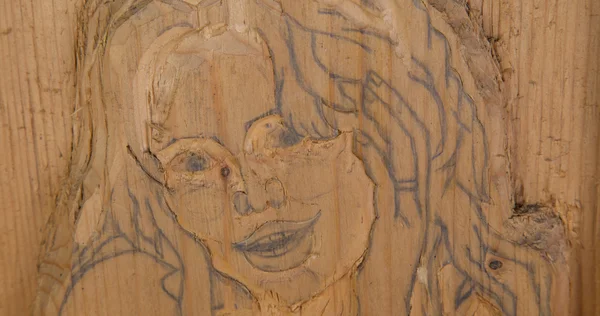 Woman carved in wood