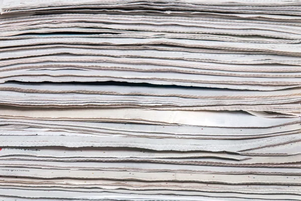 Stacked pile of newspapers