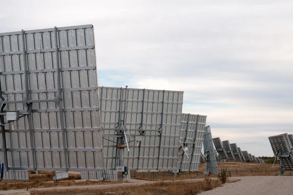 Field of solar panels gathering energy