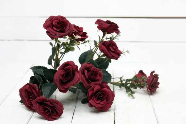 Fake bouquet of red roses isolated on a white background.