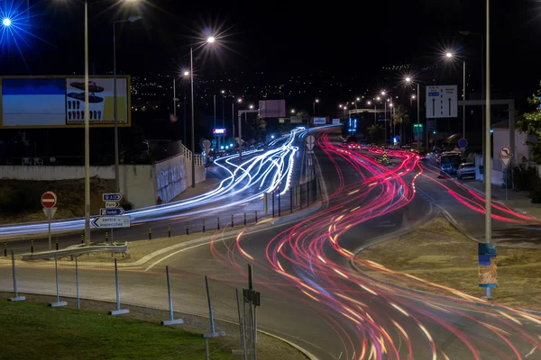 Car streak lights at night near the airport