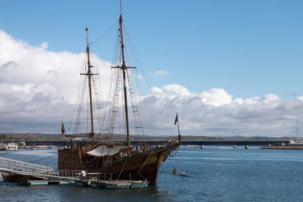 Vintage restored Caravel ship anchored