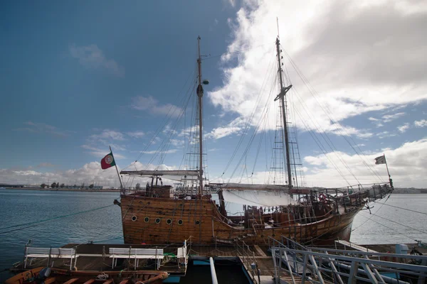 Vintage restored Caravel ship anchored