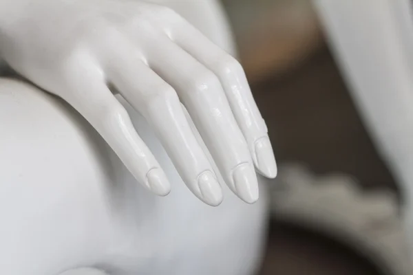 White mannequins hand on a museum