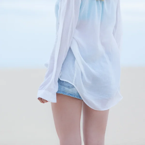 Beautiful sensual girl alone at beach.