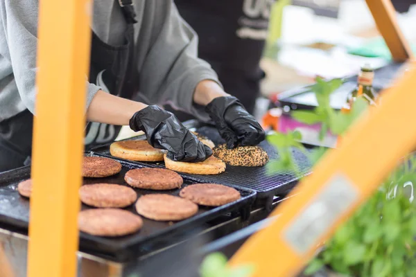 Beef burgers ready to serve on food stall.