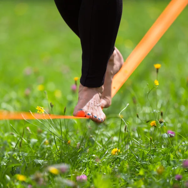 Slack line in the city park.