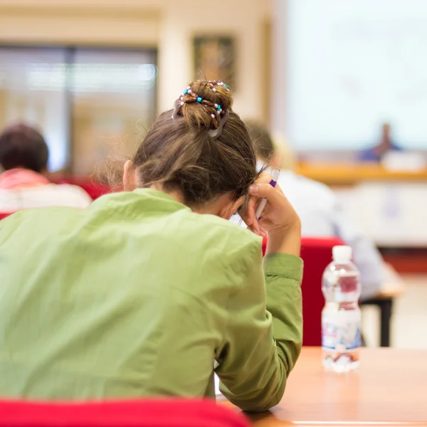 Student writing an exam.