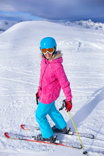 Girl skier in winter resort
